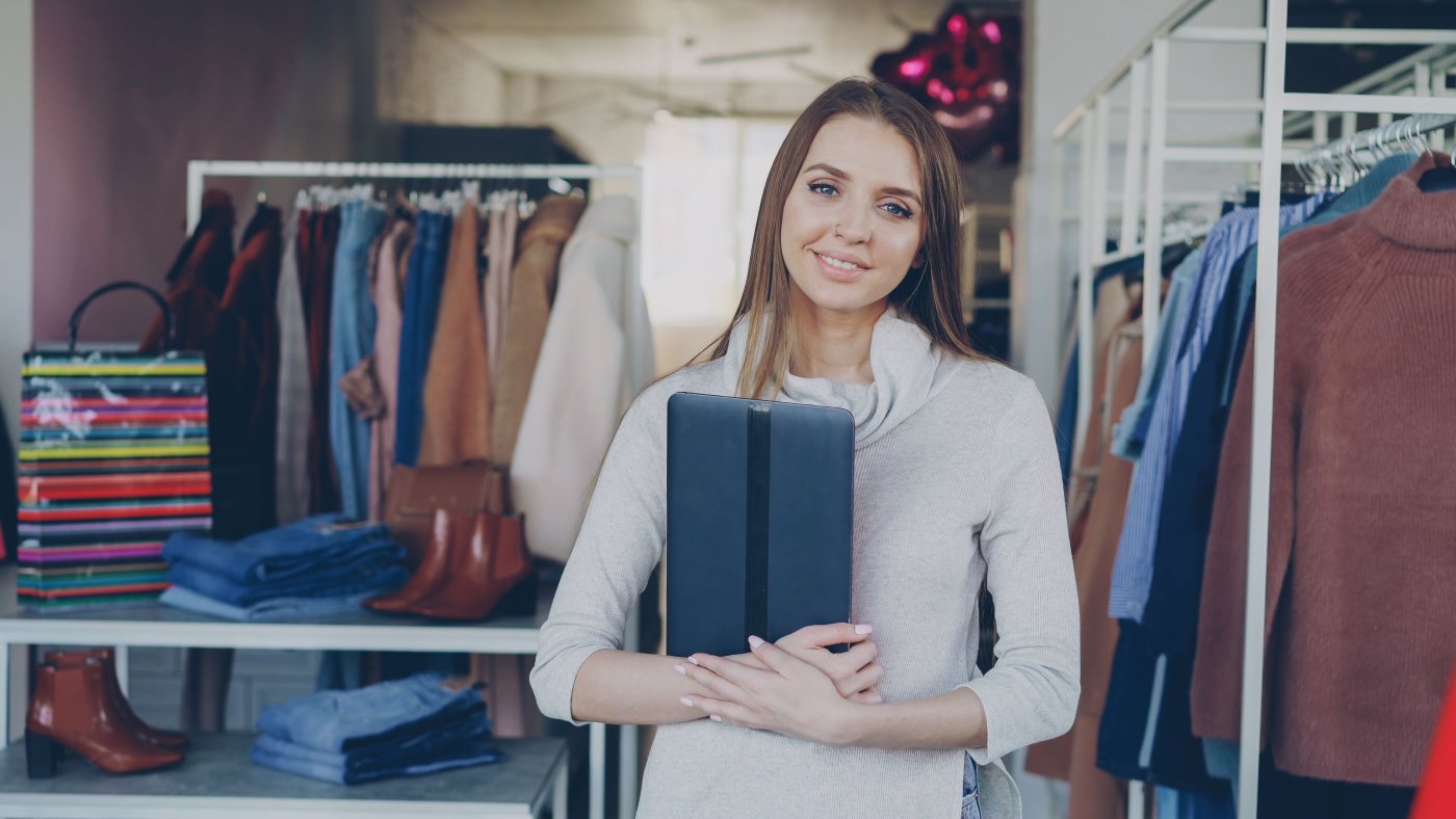 A small business owner using a tablet in her shop